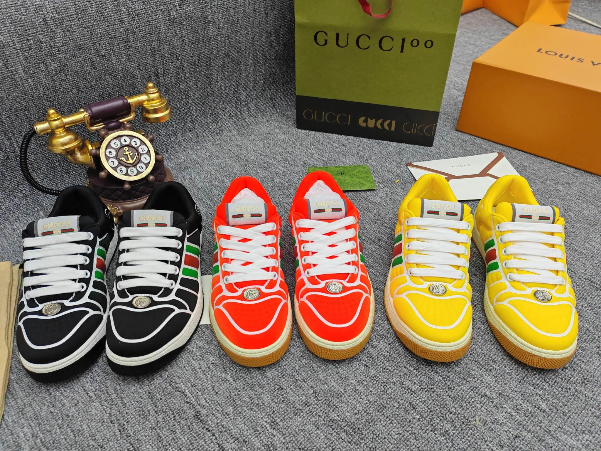Factory price 600💰Screener series embellished web sneakers. This item is from the Gucci Lido series. Its design is inspired by the summer style and beach clubs of the Italian coast. The Screener series of sneakers draws inspiration from classic sneakers from the 1970s and takes its name from a special defensive move in sports. This shoe from the 2024 Pre-Fall collection is crafted from yellow rubber, a technical and malleable opaque material, with striped webbing on the sides and an embossed Gucci printed logo on the heel. Yellow rubber, opaque and technological in appearance. Red and green webbing decorated with metal Double G oval enamel details. Gucci printed embossed logo. Women 35-40, men 38-45, (men 38 and 45 need to be customized)